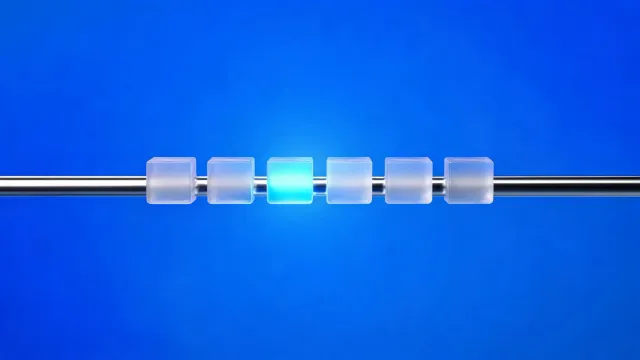 Six frosted-glass cubes on a chrome rail, one lit blue, on a blue background.