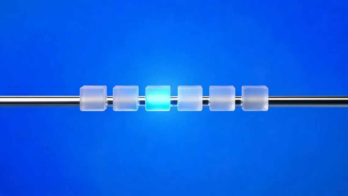 Six frosted-glass cubes on a chrome rail, one lit blue, on a blue background.