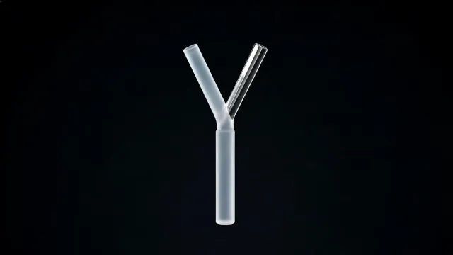 A glass rod splitting into two branches, one of them chrome, on a black background.