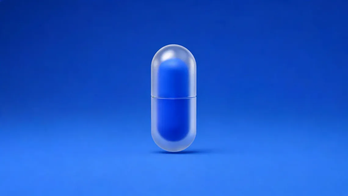 A frosted-glass capsule with a blue core, on a blue background.