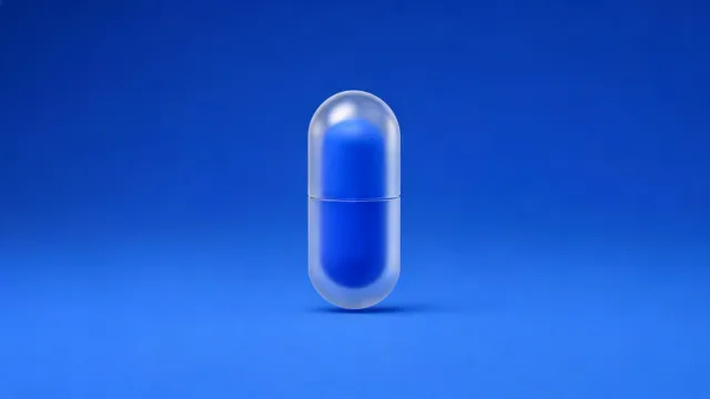 A frosted-glass capsule with a blue core, on a blue background.